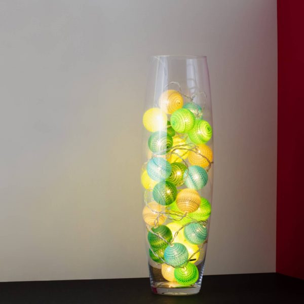 Forest green themed LED cherry light in a clear glass vase.