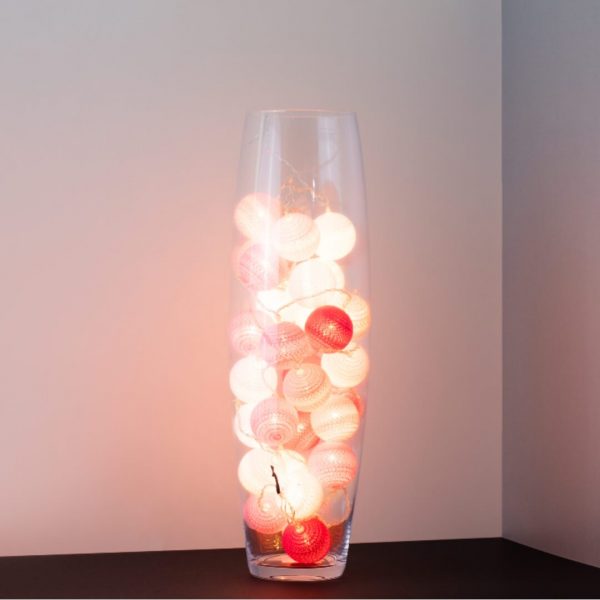 A true romance themed LED cherry light in a clear glass vase.