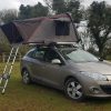 A mako56 Fold Out Roof Top Tent mounted to a car